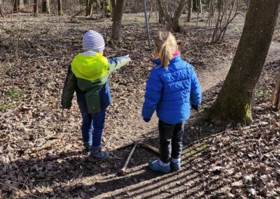 Two kids playing the scavenger hunt.